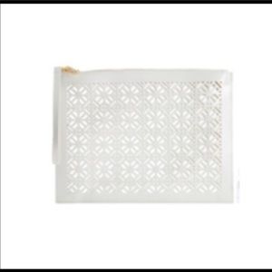 Tory Burch laser cut white wristlet. NWT